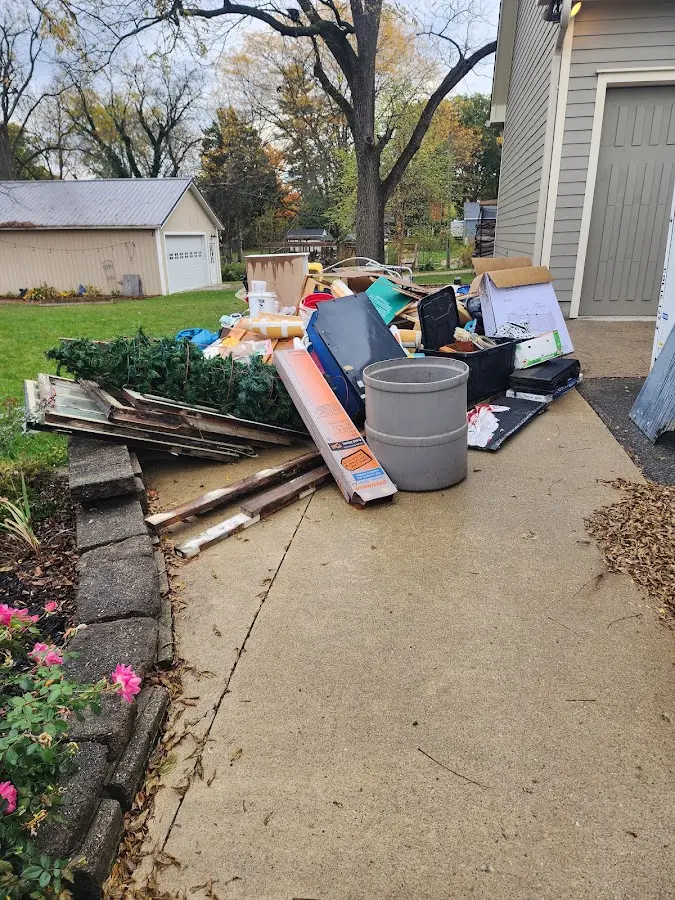 Dumpster being loaded with debris for Residential Dumpster Rental in Madera Ranchos